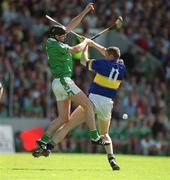2 June 2002; Brian Geary of Limerick of contests a dropping ball with Tipperary's Conor Gleeson during the Guinness Munster Senior Hurling Championship Semi-Final match between Tipperary and Limerick at Páirc U’ Chaoimh in Cork. Photo by Brendan Moran/Sportsfile