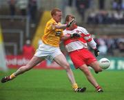 2 June 2002; Johnny McBride of Derry in action against Tony Convery of Antrim during the Bank of Ireland Ulster Senior Football Championship Quarter-Final match between Antrim and Derry at Casement Park in Belfast. Photo by Brian Lawless/Sportsfile