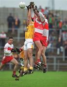2 June 2002; Sean Kelly of Antrim in action against Derry's Gary Coleman, centre, and Fergal Doherty during the Bank of Ireland Ulster Senior Football Championship Quarter-Final match between Antrim and Derry at Casement Park in Belfast. Photo by Brian Lawless/Sportsfile