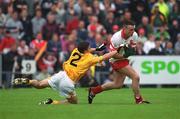 2 June 2002; Paddy Bradley of Derry in action against Sean Kelly of Antrim during the Bank of Ireland Ulster Senior Football Championship Quarter-Final match between Antrim and Derry at Casement Park in Belfast. Photo by Brian Lawless/Sportsfile