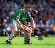 2 June 2002; Eoin O'Neill of Limerick is tackled by Thomas Dunne of Tipperary during the Guinness Munster Senior Hurling Championship Semi-Final match between Tipperary and Limerick at Páirc Uí Chaoimh in Cork. Photo by Brendan Moran/Sportsfile