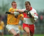 2 June 2002; Johnny McBride of Derry in action against Tony Convery of Antrim during the Bank of Ireland Ulster Senior Football Championship Quarter-Final match between Antrim and Derry at Casement Park in Belfast. Photo by Brian Lawless/Sportsfile