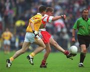 2 June 2002; Gavin Diamond of Derry in action against Sean Kelly of Antrim during the Bank of Ireland Ulster Senior Football Championship Quarter-Final match between Antrim and Derry at Casement Park in Belfast. Photo by Brian Lawless/Sportsfile