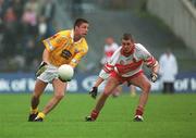2 June 2002; Gearoid Adams of Antrim in action against Derry's Gavin Diamond during the Bank of Ireland Ulster Senior Football Championship Quarter-Final match between Antrim and Derry at Casement Park in Belfast. Photo by Brian Lawless/Sportsfile