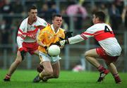 2 June 2002; Declan McKay of Antrim in action against Derry's Joe Keenan, right, during the Ulster Minor Football Championship Quarter-Final match between Derry and Antrim at Casement Park in Belfast, Antrim. Photo by Brian Lawless/Sportsfile