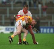 2 June 2002; Enda McLernon of Antrim in action against Derry's Gavin Diamond during the Bank of Ireland Ulster Senior Football Championship Quarter-Final match between Antrim and Derry at Casement Park in Belfast. Photo by Brian Lawless/Sportsfile
