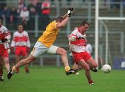 2 June 2002; Ciaran McNally of Derry in action against Joe Quinn of Antrim during the Bank of Ireland Ulster Senior Football Championship Quarter-Final match between Antrim and Derry at Casement Park in Belfast. Photo by Brian Lawless/Sportsfile