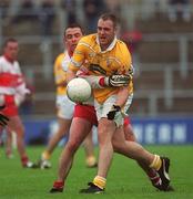 2 June 2002; Joe Quinn of Antrim in action against Derry's Ciaran McNally during the Bank of Ireland Ulster Senior Football Championship Quarter-Final match between Antrim and Derry at Casement Park in Belfast. Photo by Brian Lawless/Sportsfile