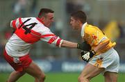 2 June 2002; Sean Kelly of Antrim in action against Derry's Paddy Bradley during the Bank of Ireland Ulster Senior Football Championship Quarter-Final match between Antrim and Derry at Casement Park in Belfast. Photo by Brian Lawless/Sportsfile