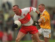 2 June 2002; Dermot Dougan of Derry in action against Enda McLernon of Antrim during the Bank of Ireland Ulster Senior Football Championship Quarter-Final match between Antrim and Derry at Casement Park in Belfast. Photo by Brian Lawless/Sportsfile