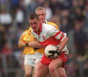 2 June 2002; Gavin Diamond of Derry in action against Enda McLernon of Antrim during the Bank of Ireland Ulster Senior Football Championship Quarter-Final match between Antrim and Derry at Casement Park in Belfast. Photo by Brian Lawless/Sportsfile