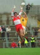 2 June 2002; Anthony Tohill of Derry in action against Gavin Bell of Antrim during the Bank of Ireland Ulster Senior Football Championship Quarter-Final match between Antrim and Derry at Casement Park in Belfast. Photo by Brian Lawless/Sportsfile