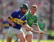 2 June 2002; David Kennedy of Tipperary in action against Ollie Moran of Limerick during the Guinness Munster Senior Hurling Championship Semi-Final match between Tipperary and Limerick at Páirc U’ Chaoimh in Cork. Photo by Brendan Moran/Sportsfile
