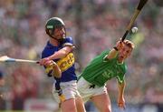 2 June 2002; LImerick's Ollie Moran attempts to block down a clearance by Tipperary's David Kennedy during the Guinness Munster Senior Hurling Championship Semi-Final match between Tipperary and Limerick at Páirc U’ Chaoimh in Cork. Photo by Brendan Moran/Sportsfile