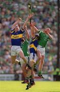 2 June 2002; Tipperary's Conor Gleeson, left, and Thomas Dunne contest a dropping ball with Limerick's Ciaran Carey, right, and Brian Geary during the Guinness Munster Senior Hurling Championship Semi-Final match between Tipperary and Limerick at Páirc Uí Chaoimh in Cork. Photo by Brendan Moran/Sportsfile