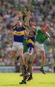 2 June 2002; Tipperary's Conor Gleeson, left, and Thomas Dunne contest a dropping ball with Limerick's Ciaran Carey, right, and Brian Geary during the Guinness Munster Senior Hurling Championship Semi-Final match between Tipperary and Limerick at Páirc U’ Chaoimh in Cork. Photo by Brendan Moran/Sportsfile