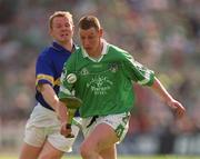 2 June 2002; Ciaran Carey of Limerick in action against Tipperary's Conor Gleeson during the Guinness Munster Senior Hurling Championship Semi-Final match between Tipperary and Limerick at Páirc Uí Chaoimh in Cork. Photo by Brendan Moran/Sportsfile