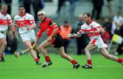 25 May 2002; Noel Sands of Down in action against Colin Eldowney of Derry during the Guinness Ulster Senior Hurling Championship Semi-Final match between Down and Derry at Casement Park in Belfast. Photo by Damien Eagers/Sportsfile