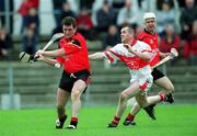 25 May 2002; Michael Braniff of Down in action against Benny Ward of Derry during the Guinness Ulster Senior Hurling Championship Semi-Final match between Down and Derry at Casement Park in Belfast. Photo by Damien Eagers/Sportsfile