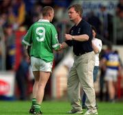 2 June 2002; Limerick's Ciaran Carey shakes hands with Tipperary manager Nicky English following the Guinness Munster Senior Hurling Championship Semi-Final match between Tipperary and Limerick at Páirc U’ Chaoimh in Cork. Photo by Brendan Moran/Sportsfile