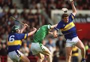 2 June 2002; Noel Morris of Tipperary, fields a high ball from team-mate David kennedy, left, and Limerick's Stephen Lucey during the Guinness Munster Senior Hurling Championship Semi-Final match between Tipperary and Limerick at Páirc U’ Chaoimh in Cork. Photo by Brendan Moran/Sportsfile