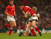 25 May 2002; David Wallace of Munster is tackled by Lewis Moody of Leicester Tigers during the Heineken Cup Final match between Leicester Tigers and Munster at the Millennium Stadium in Cardiff, Wales. Photo by Brendan Moran/Sportsfile