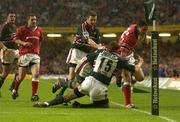 25 May 2002; Jeremy Staunton of Munster is stopped short of the try line by Leicester Tigers players Tim Stimpson, Geordan Murphy and Rod Kafer during the Heineken Cup Final match between Leicester Tigers and Munster at the Millennium Stadium in Cardiff, Wales. Photo by Brendan Moran/Sportsfile