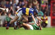 2 June 2002; Brendan Dunne of Tipperary in action against Stephen Lucey of Limerick during the Guinness Munster Senior Hurling Championship Semi-Final match between Tipperary and Limerick at Páirc U’ Chaoimh in Cork. Photo by Brendan Moran/Sportsfile