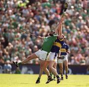 2 June 2002; Brian Geary of Limerick in action against Conor Gleeson of Tipperary during the Guinness Munster Senior Hurling Championship Semi-Final match between Tipperary and Limerick at Páirc U’ Chaoimh in Cork. Photo by Brendan Moran/Sportsfile
