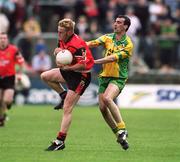 2 June 2002; Brendan Coulter of Down in action against Jim McGuinness of Donegal during the Bank of Ireland Ulster Senior Football Championship Quarter-Final match between Donegal and Down at MacCumhail Park in Ballybofey, Donegal. Photo by Damien Eagers/Sportsfile