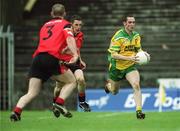 2 June 2002; Brendan Devenney of Donegal breaks away from the Down defence during the Bank of Ireland Ulster Senior Football Championship Quarter-Final match between Donegal and Down at MacCumhail Park in Ballybofey, Donegal. Photo by Damien Eagers/Sportsfile