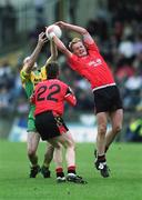2 June 2002; Brendan Coulter of Down contests a high ball with Paul McGonigle of Donegal during the Bank of Ireland Ulster Senior Football Championship Quarter-Final match between Donegal and Down at MacCumhail Park in Ballybofey, Donegal. Photo by Damien Eagers/Sportsfile