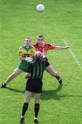 2 June 2002; Referee Gerry Kinneavy throws the ball in between John Gildea of Donegal and Brian Burns of Down at the throw in during the Bank of Ireland Ulster Senior Football Championship Quarter-Final match between Donegal and Down at MacCumhail Park in Ballybofey, Donegal. Photo by Damien Eagers/Sportsfile