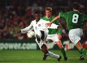 16 May 2002; Bartholomew Ogbeche of Nigeria in action against the Republic of Ireland's Steve Staunton, left, and Mark Kinsella during the International Friendly match between Republic of Ireland and Nigeria at Lansdowne Road in Dublin. Photo by David Maher/Sportsfile