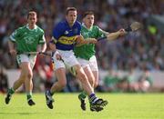 2 June 2002; Brian O'Meara of Tipperary in action against Barry Foley of Limerick during the Guinness Munster Senior Hurling Championship Semi-Final match between Tipperary and Limerick at Páirc U’ Chaoimh in Cork. Photo by Brendan Moran/Sportsfile