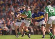 2 June 2002; James Butler of Limerick in action against Philip Maher, left, and Donnacha Fahy Tipperary during the Guinness Munster Senior Hurling Championship Semi-Final match between Tipperary and Limerick at Páirc U’ Chaoimh in Cork. Photo by Brendan Moran/Sportsfile
