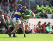 2 June 2002; Brian Begley of Limerick in action against David Kennedy of Tipperary during the Guinness Munster Senior Hurling Championship Semi-Final match between Tipperary and Limerick at Páirc Uí Chaoimh in Cork. Photo by Brendan Moran/Sportsfile