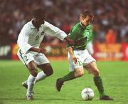16 May 2002; David Connolly of Republic of Ireland, in action against Joseph Yobo of Nigeria during the International Friendly match between Republic of Ireland and Nigeria at Lansdowne Road in Dublin. Photo by Matt Browne/Sportsfile