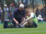 8 June 2002; Republic of Ireland physio Mick Byrne tends to Kevin Kilbane following and injury during a Republic of Ireland training session in Chiba, Japan. Photo by David Maher/Sportsfile