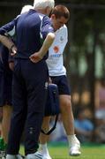 8 June 2002; Kevin Kilbane with Republic of Ireland physio Mick Byrne, hidden, and Dr Martin Walsh following an injury during a Republic of Ireland training session in Chiba, Japan. Photo by David Maher/Sportsfile
