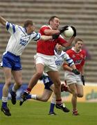 8 June 2002; Seamus O'Hanlon of Louth fields a high ball from James McElroy of Monaghan during the Bank of Ireland All-Ireland Senior Football Championship Qualifier Round 1 match between Monaghan and Louth at St Tiernach's Park in Clones, Monaghan. Photo by Brendan Moran/Sportsfile