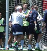 9 June 2002; Gary Breen laughs as Dean Keily is led away by physio Mick Byrne for treatment during a Republic of Ireland training session in Chiba, Japan. Photo by David Maher/Sportsfile