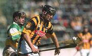 9 June 2002; Eddie Brennan of Kilkenny races clear of Offaly's John Paul O'Meara on his way to scoring the first goal during the Guinness Leinster Senior Hurling Championship Semi-Final match between Kilkenny and Offaly at Semple Stadium in Thurles, Tipperary. Photo by Ray McManus/Sportsfile