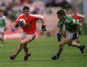 9 June 2002; Ronan Clarke of Armagh in action against Michael Lilly of Fermanagh during the Bank of Ireland Ulster Senior Football Championship Semi-Final match between Armagh and Fermanagh at St TiernachÕs Park in Clones, Monaghan. Photo by Damien Eagers/Sportsfile