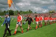 9 June 2002; Armagh captain Kieran McGeeney leads his team in the pre-match parade prior to the Bank of Ireland Ulster Senior Football Championship Semi-Final match between Armagh and Fermanagh at St TiernachÕs Park in Clones, Monaghan. Photo by Damien Eagers/Sportsfile