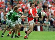 9 June 2002; Ronan Clarke of Armagh in action against Paddy McGuinness of Fermanagh during the Bank of Ireland Ulster Senior Football Championship Semi-Final match between Armagh and Fermanagh at St TiernachÕs Park in Clones, Monaghan. Photo by Damien Eagers/Sportsfile