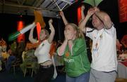 11 June 2002; Republic of Ireland supporters, from left, Vanessa Tucker, from Leixlip, Niamh O'Farrell, from Goatstown and Joe Boyle, from Donegal, celebrate following their side's victory during the FIFA World Cup 2002 Group E match between Saudi Arabia and Republic of Ireland at the 'Big In Japan' event at the RDS in Ballsbridge, Dublin. Photo by Aoife Rice/Sportsfile