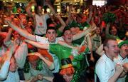 11 June 2002; Republic of Ireland supporters celebrate their side's second goal, scored by Gary Breen, as they watch the FIFA World Cup 2002 Group E match between Saudi Arabia and Republic of Ireland at The Submarine Bar in Crumlin, Dublin. Photo by Brendan Moran/Sportsfile