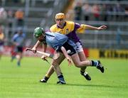 9 June 2002; Dublin's Philip Brennan is tackled by Michael Jordan of Wexford during the Guinness Leinster Senior Hurling Championship Semi-Final match between Wexford and Dublin at Semple Stadium in Thurles, Tipperary. Photo by Aoife Rice/Sportsfile