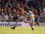 9 June 2002; Kilkenny's Martin Comerford is tackled by John Paul O'Meara of Offaly during the Guinness Leinster Senior Hurling Championship Semi-Final match between Kilkenny and Offaly at Semple Stadium in Thurles, Tipperary. Photo by Ray McManus/Sportsfile